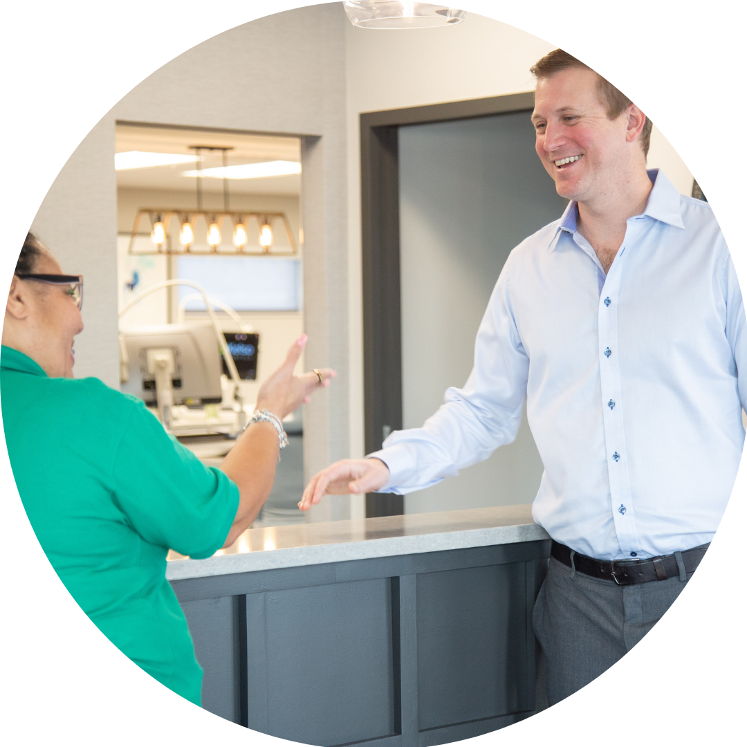 adult patient smiling with dr. during visit